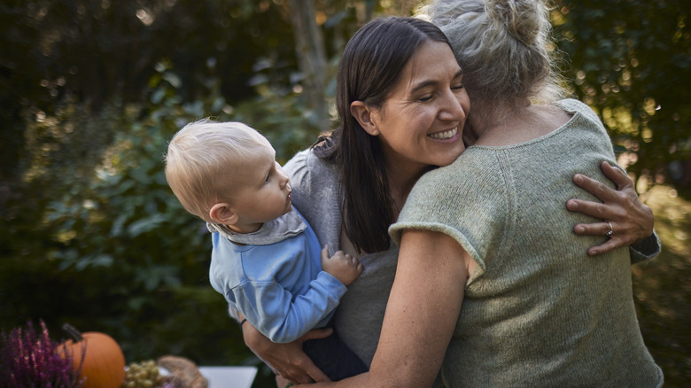 Family hugging during fall