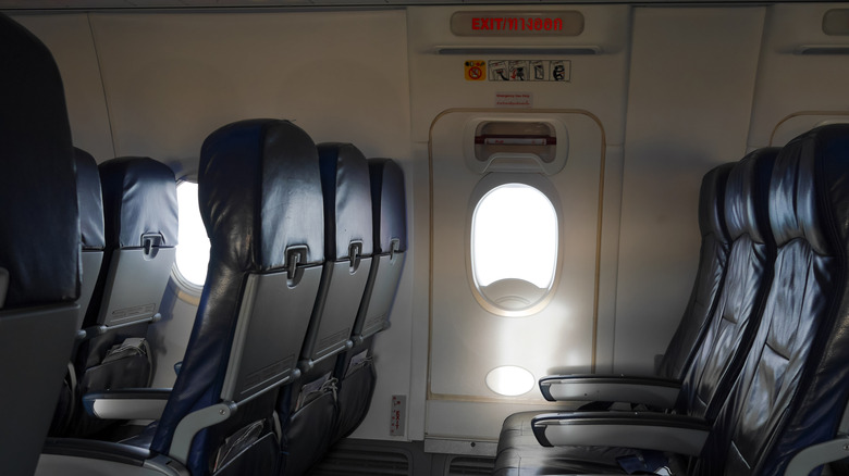 Empty exit row seats on a plane