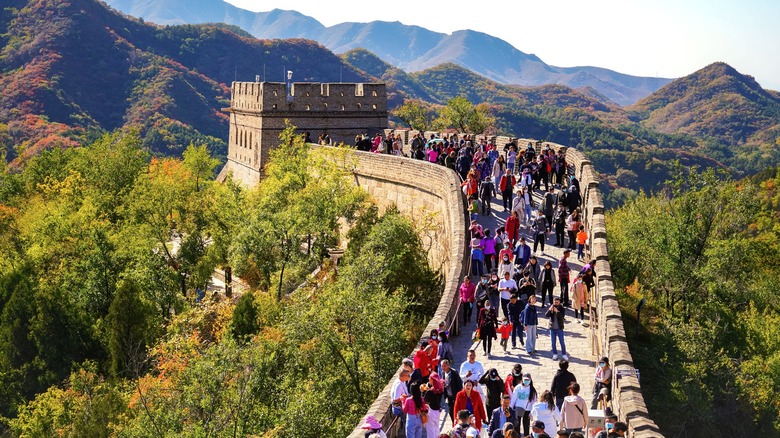 Throngs of tourists walk the Great Wall of China