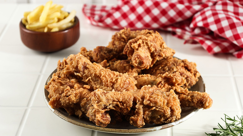 plate of crispy fried chicken with fries