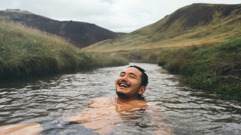 Person soaking in Icelandic spring 