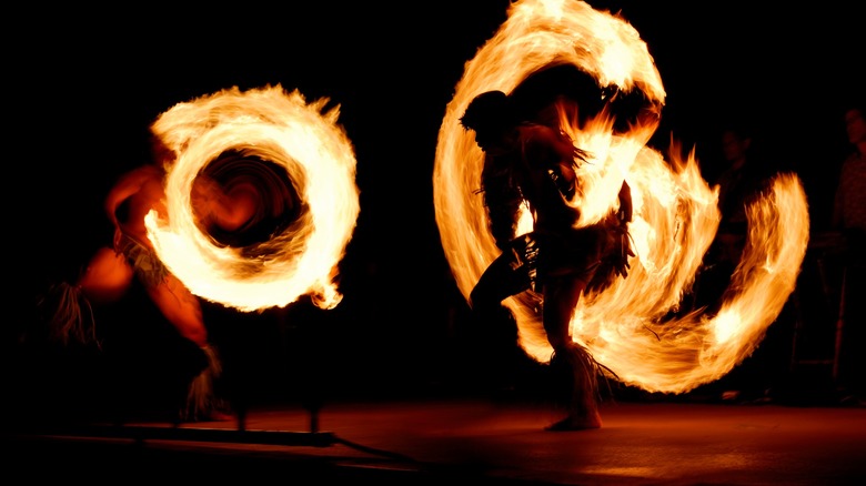 Traditional fire dance in cultural garb