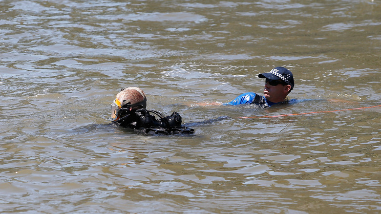 Divers in Brisbane River