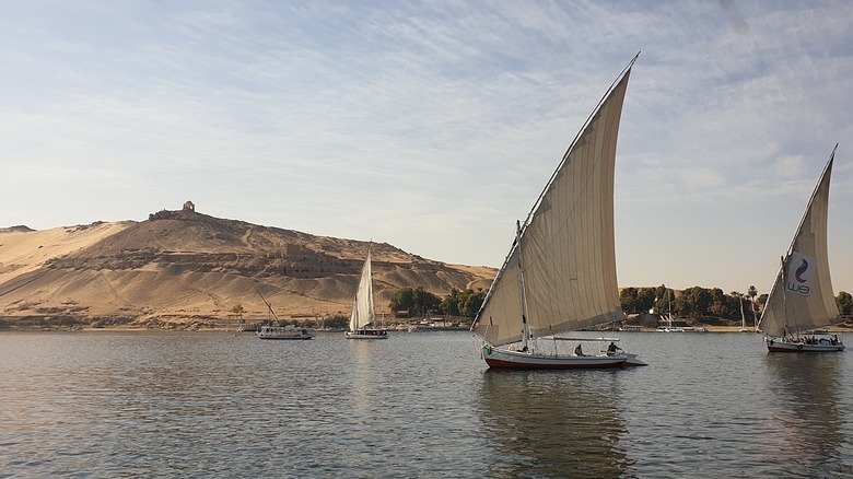 Nile with pyramids in background