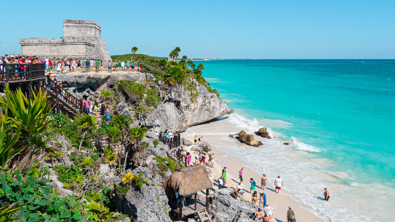 A crowd on a beach in Tulum, Mexico