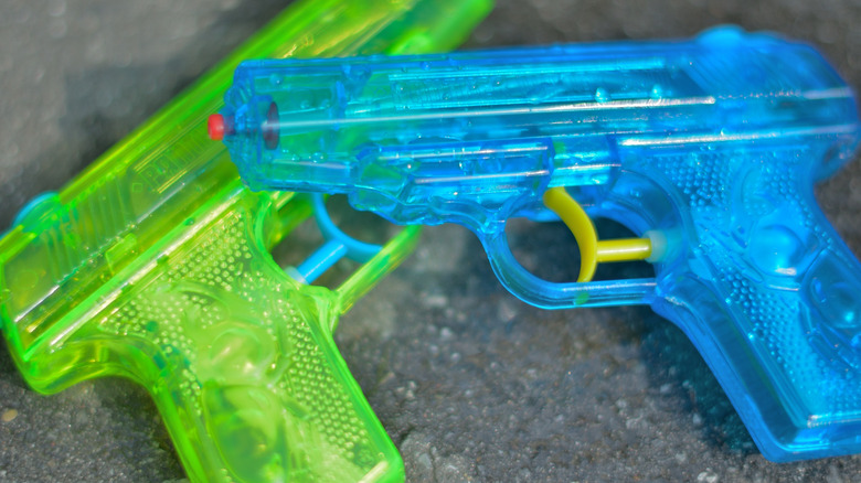 water guns clear blue green