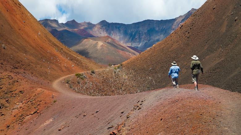 Two people hiking rocky terrain