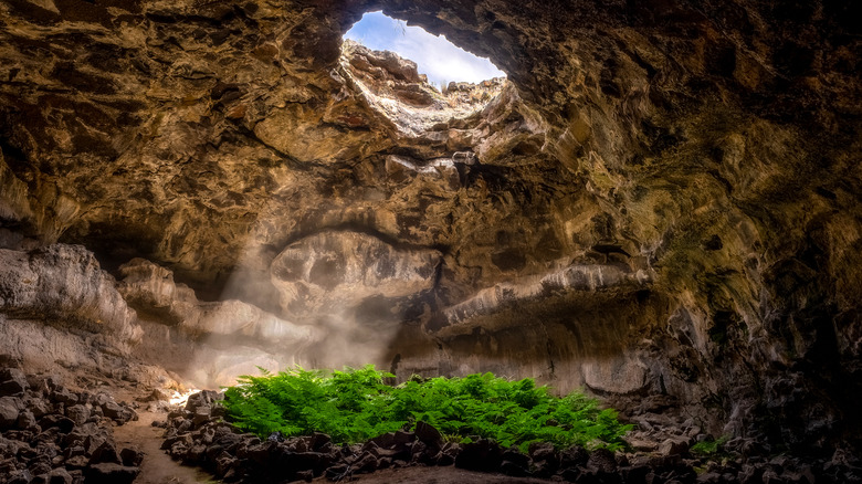 Sunrays through hole in cave