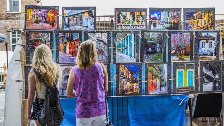 Two women looking at artwork