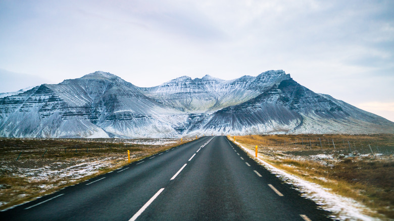 a road in Iceland set against the mountains