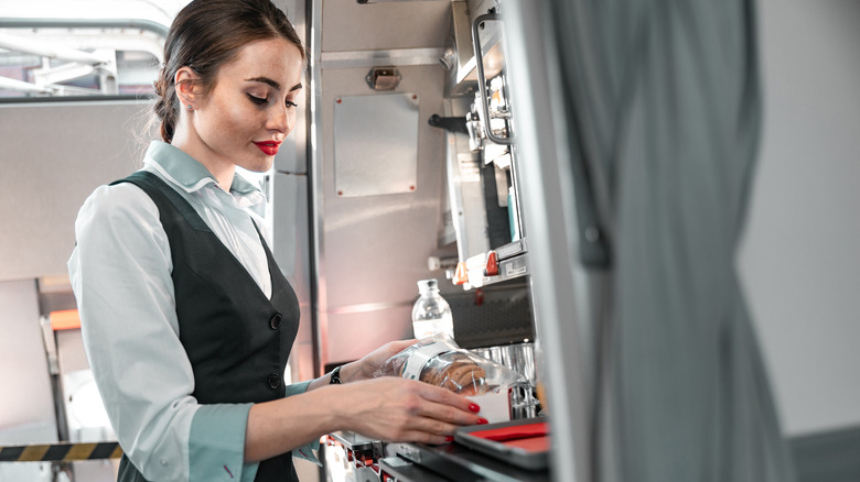 Flight attendant in the galley