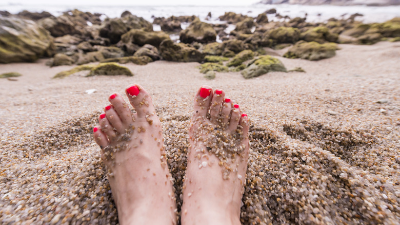 Painted toenails at the beach