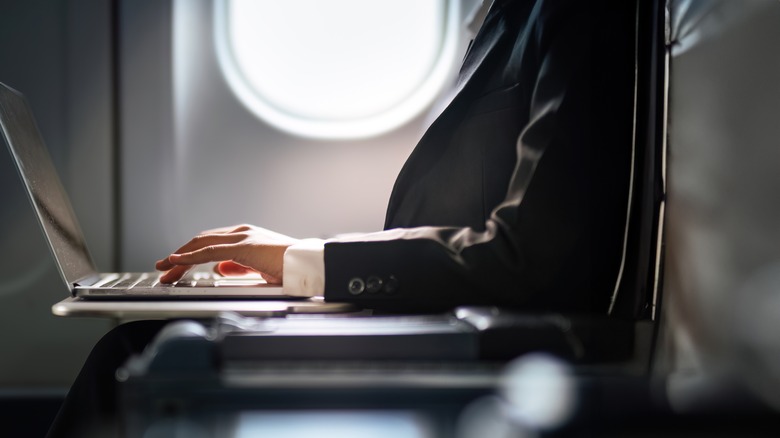 Person in a suit working on a flight