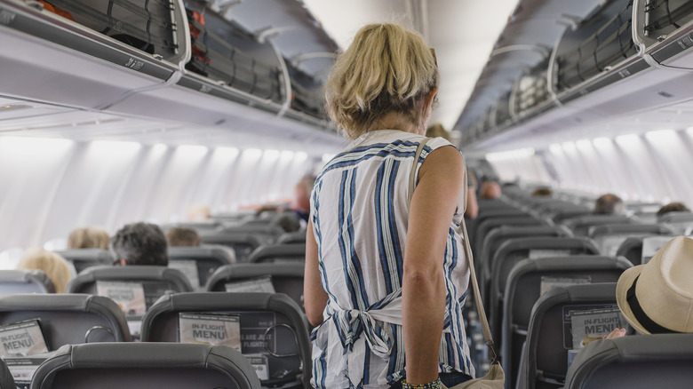 Woman wearing sleeveless top on flight