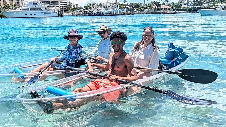 People on clear kayak tour