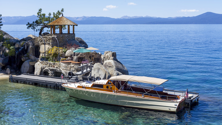 Wooden boat docked at the Thunderbird Lodge