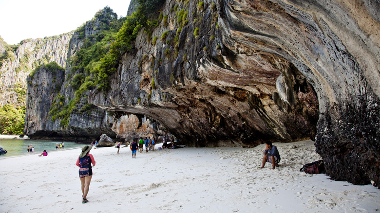 visitors on Maya Bay beach cliffside