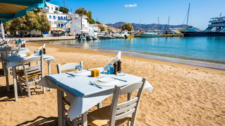 Cafe tables on a beach in Psathi, Kimolos, Greece