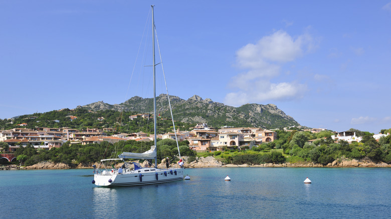 Coastal view with boat and buildings