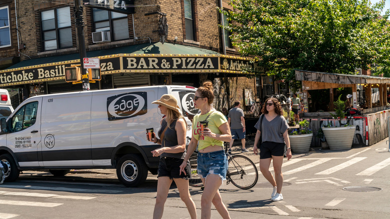 Women in front of bar in Bushwick during the summer