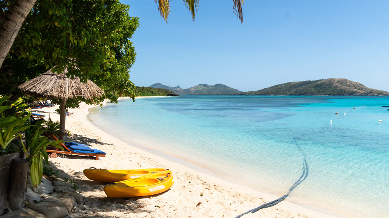 Idyllic beach in Fiji with white sands and clear blue water