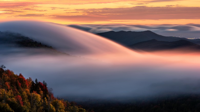 low clouds over fall mountains