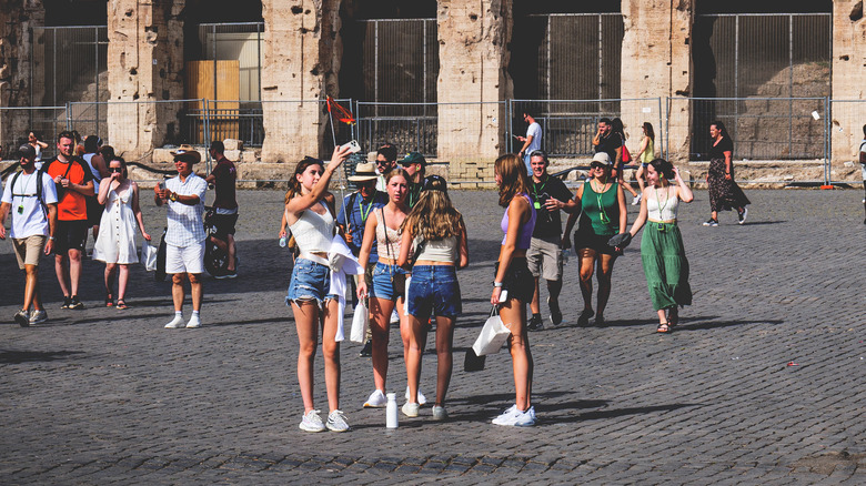 Tourists in shorts and crop-tops