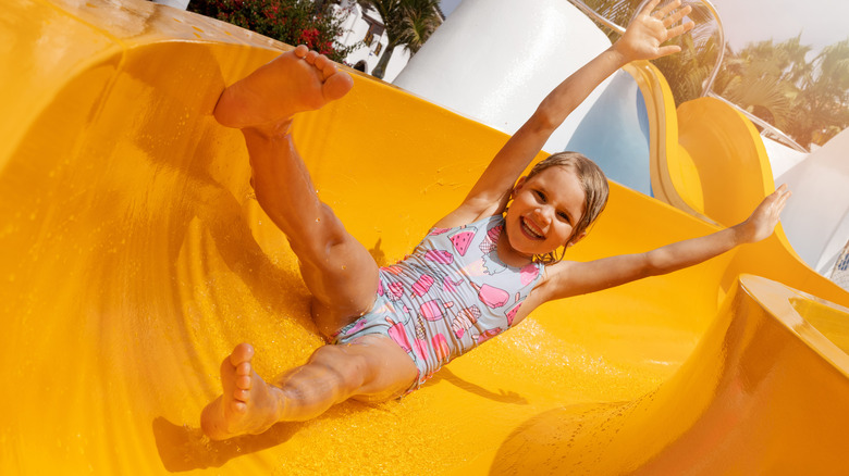 child on a water slide