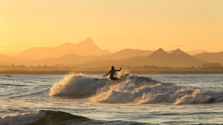 Surfer surfing in the sunset