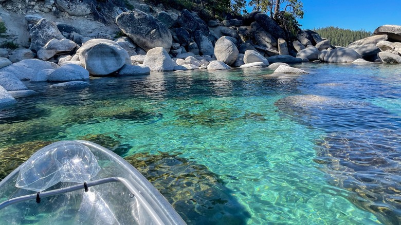 Paddling in a clear kayak on Lake Tahoe