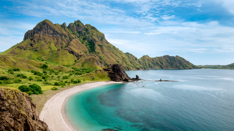 White sand beaches and mountains in Flores Island