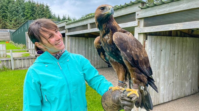 woman holding golden eagle