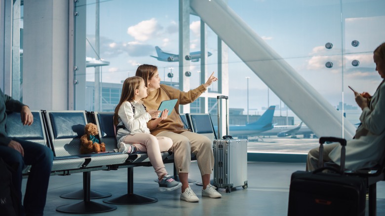 woman and child in airport seats