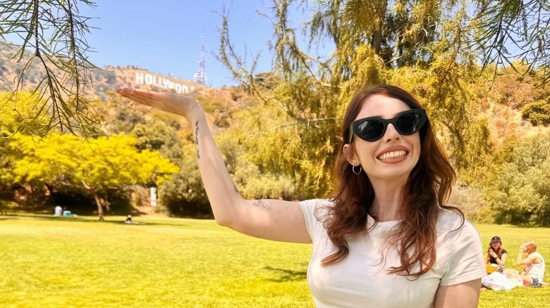 posing with the Hollywood sign at Lake Hollywood Park