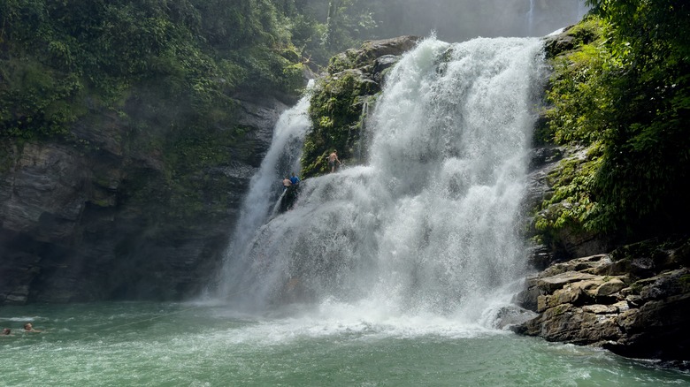 nauyaca upper falls with people swimming