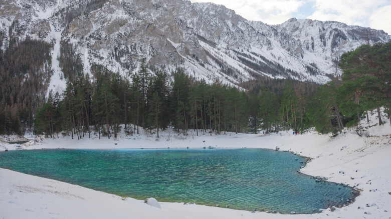 Heart-shaped alpine lake in winter