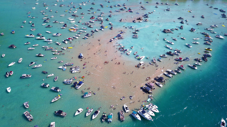 The busy Torch Lake sandbar