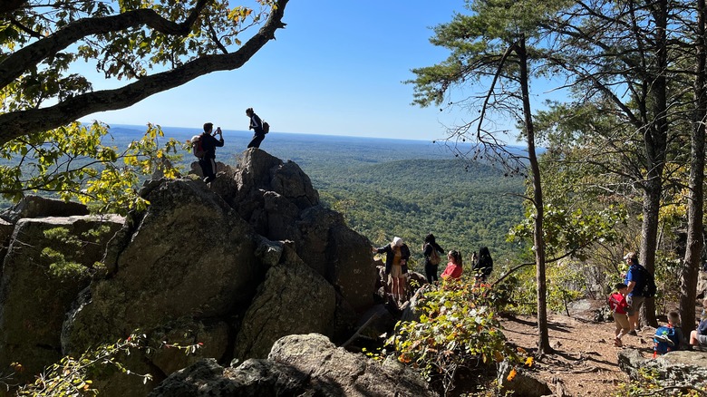 Visitors to Crowders Mountain in North Carolina enjoying the view