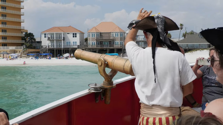 Pirate shooting cannon on ship