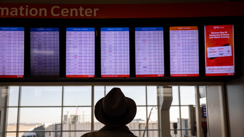 a board of cancellations at Dallas Fort Worth International Airport