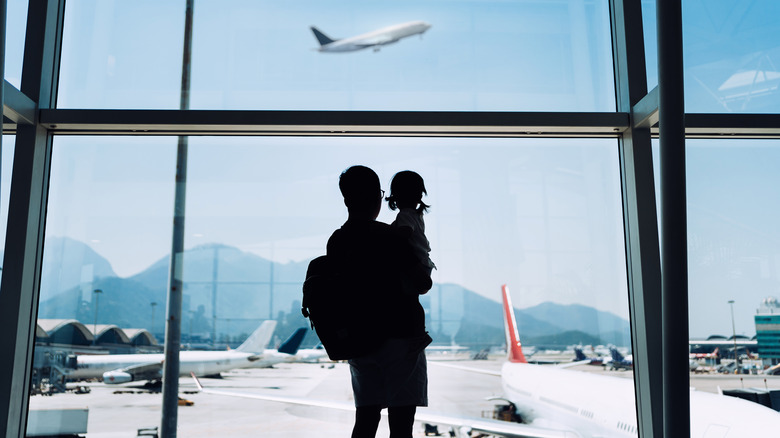 Parent and child at airport