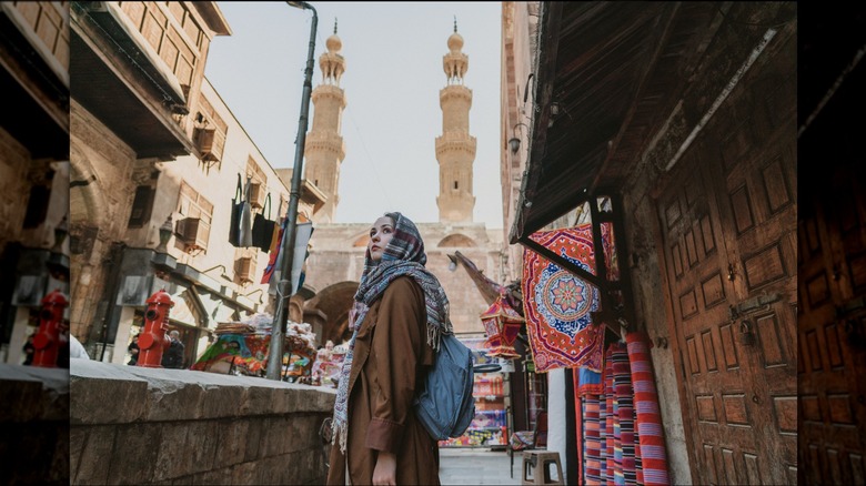 woman walking through Cairo market