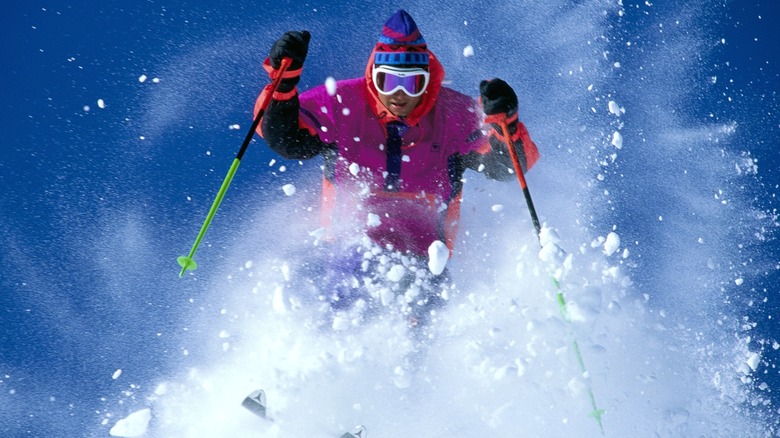 Man skiing pink jacket