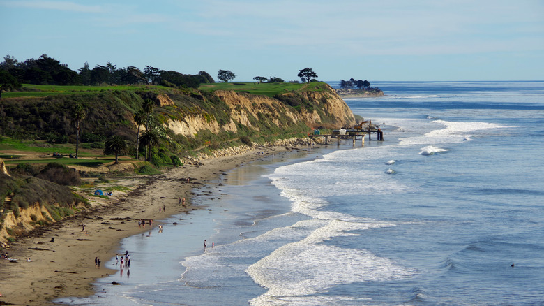 People walking on a long beach