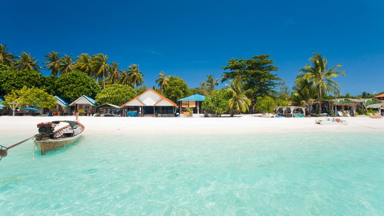 Bungalows line a white-sand beach in Thailand