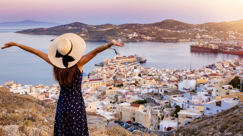 Woman overlooking Greek city
