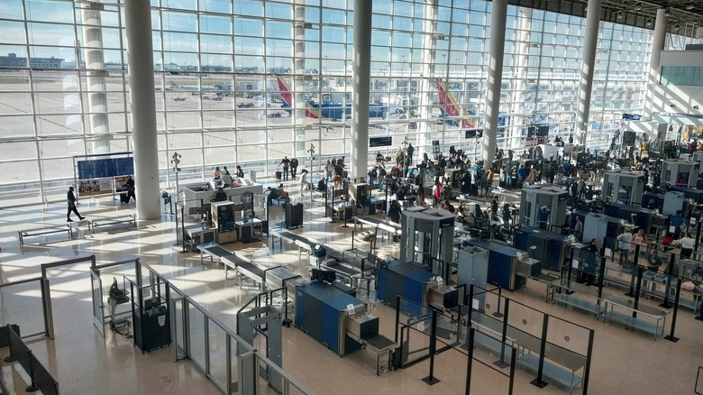 Travelers going through TSA security