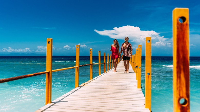 Couple on a tropical pier