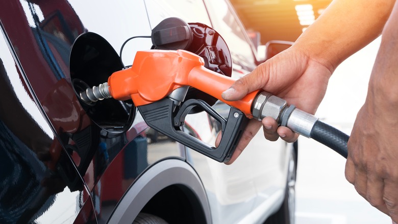 A car is refueled at a gas pump