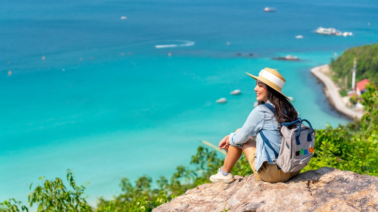 Woman looking over the coastline